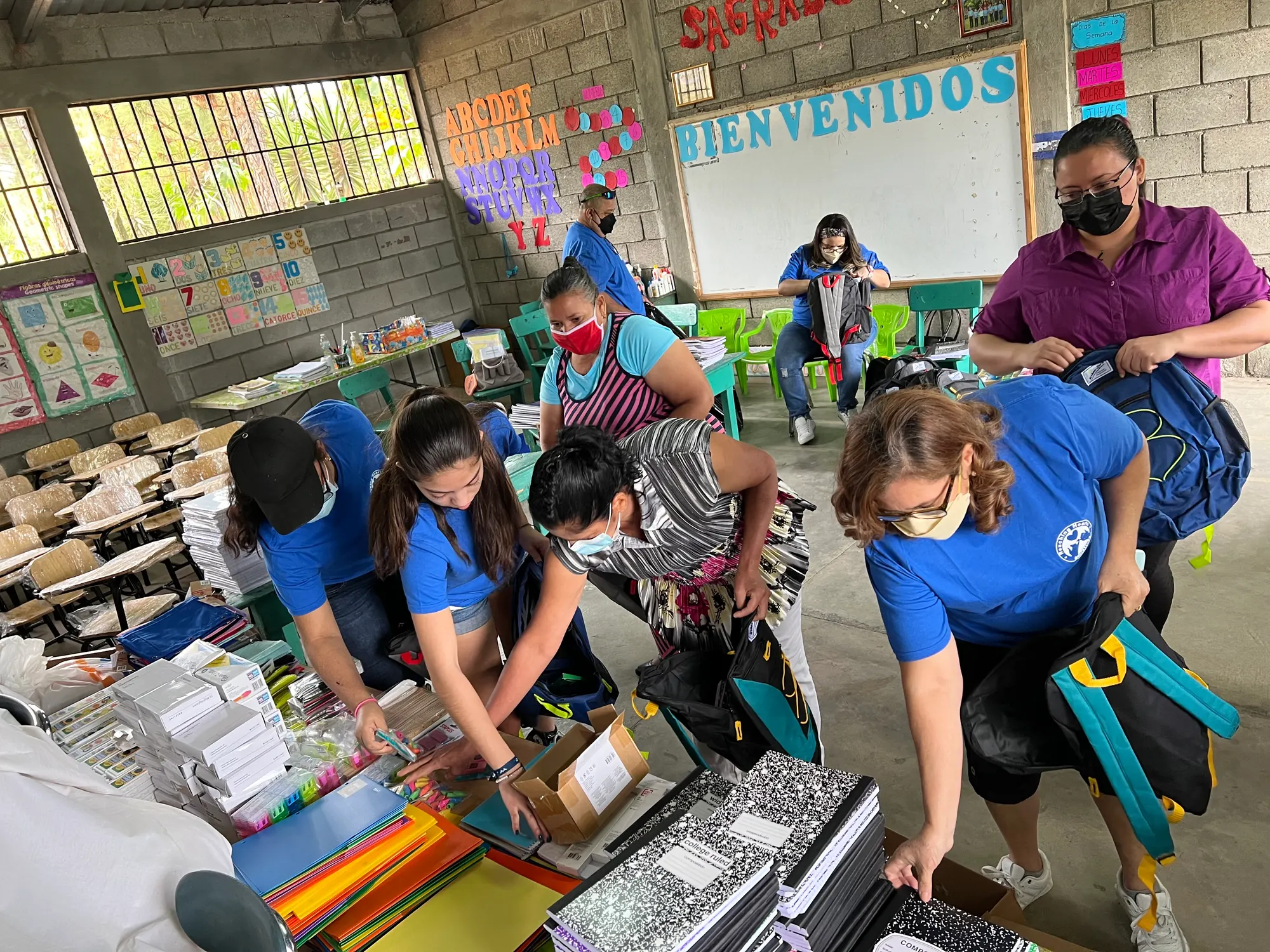 Handing out school supplies to children in Honduras