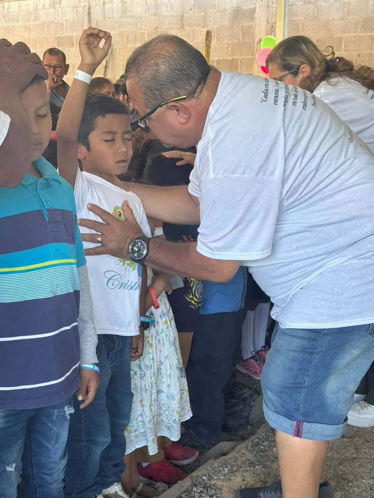 A child being prayed over at a ministry event in Honduras